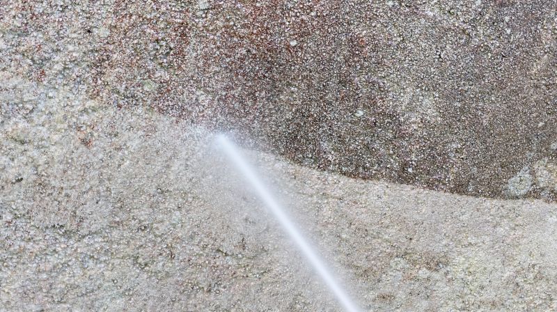 Power Washing on a Building Exterior